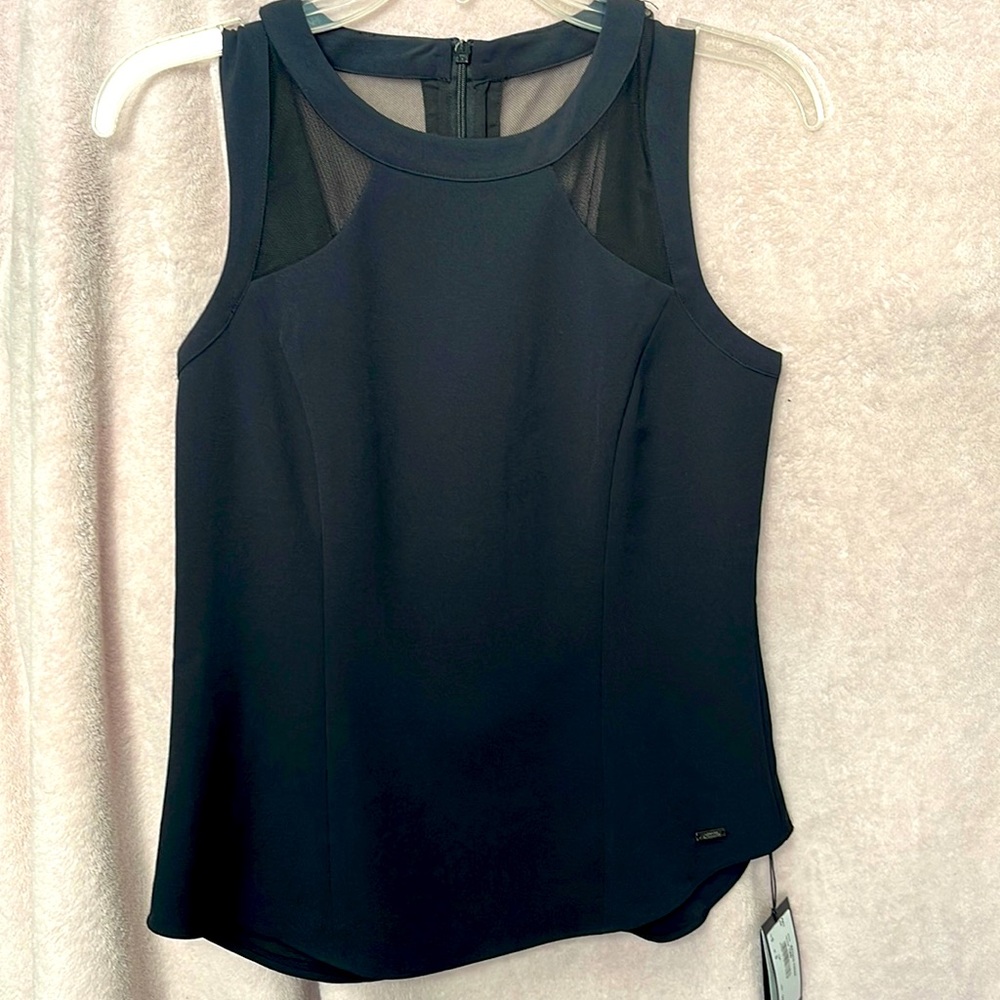 New with tag shirt, Black sleeveless, zipper up back side.